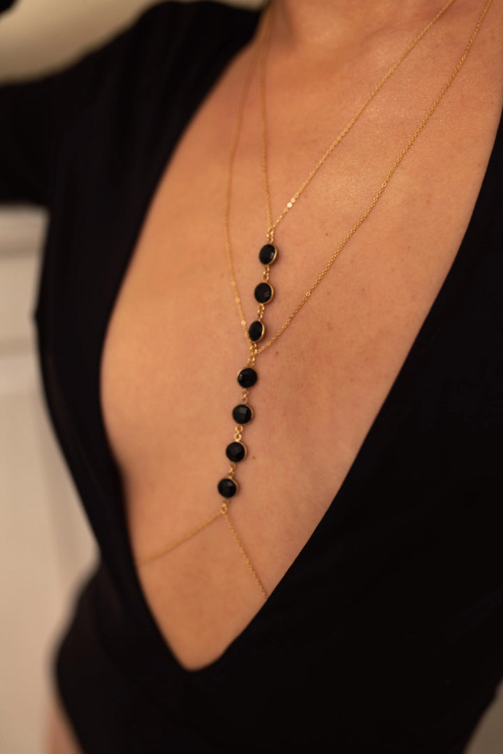 Woman wearing labradorite body chain made of 925 sterling silver beach jewelry