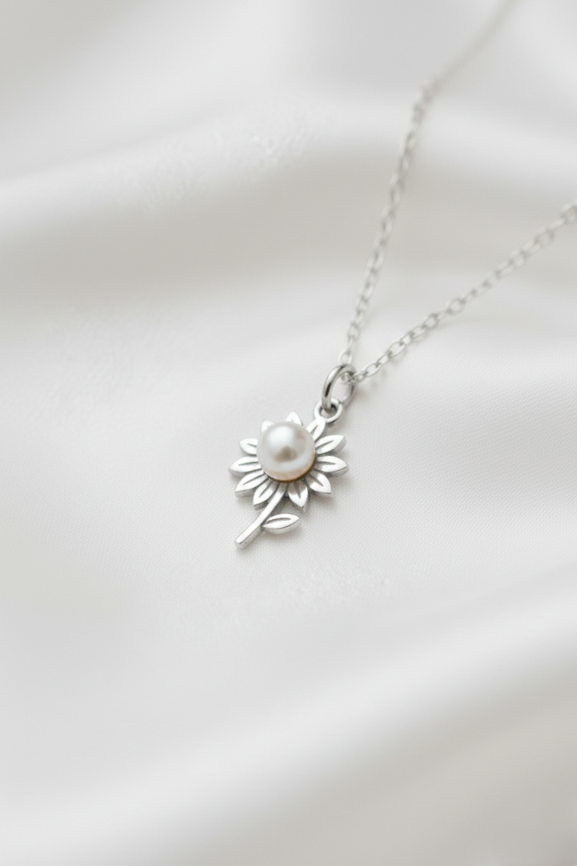 Sterling silver sunflower pendant necklace with a genuine freshwater pearl center on a delicate 925 silver chain for women.