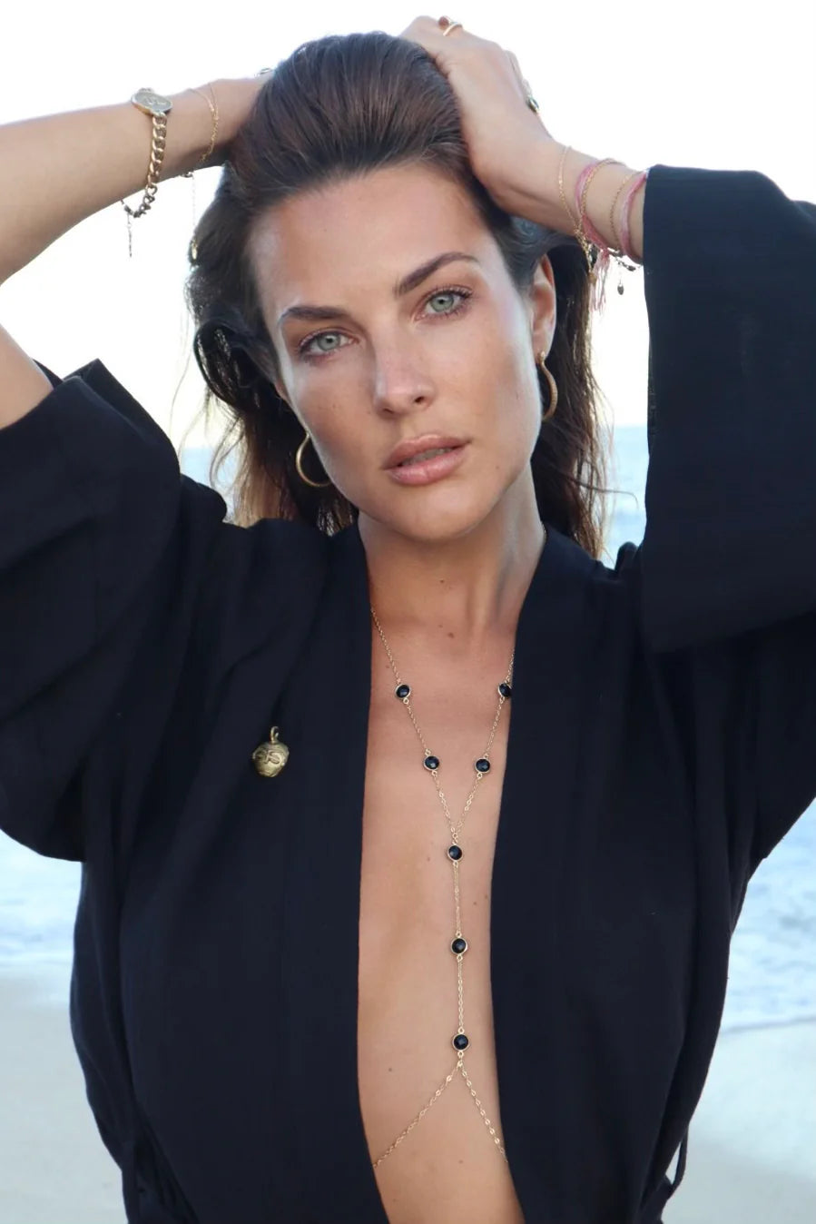 Woman wearing labradorite body chain made of 925 sterling silver beach jewelry